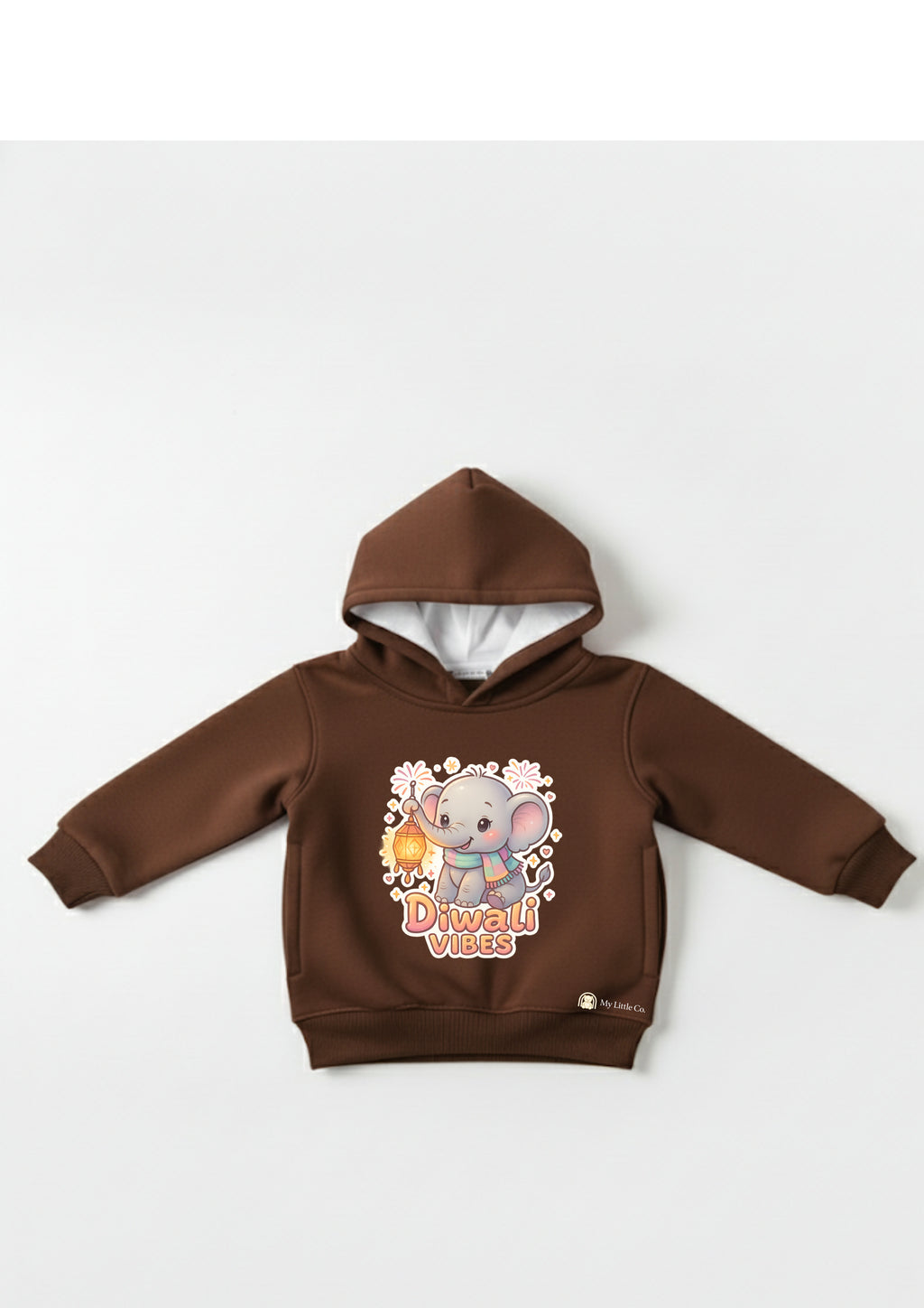 Close-up of vibrant cartoon elephant DTF print on rich brown cotton fleece.