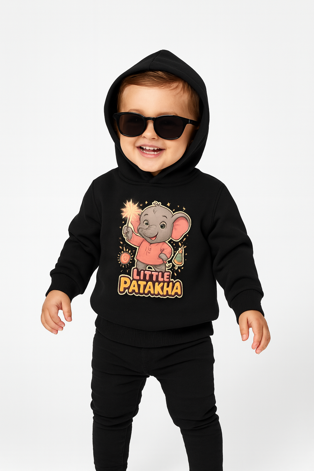 Close-up of witty "Little Patakha" slogan and sparkler elephant graphic on black fabric.