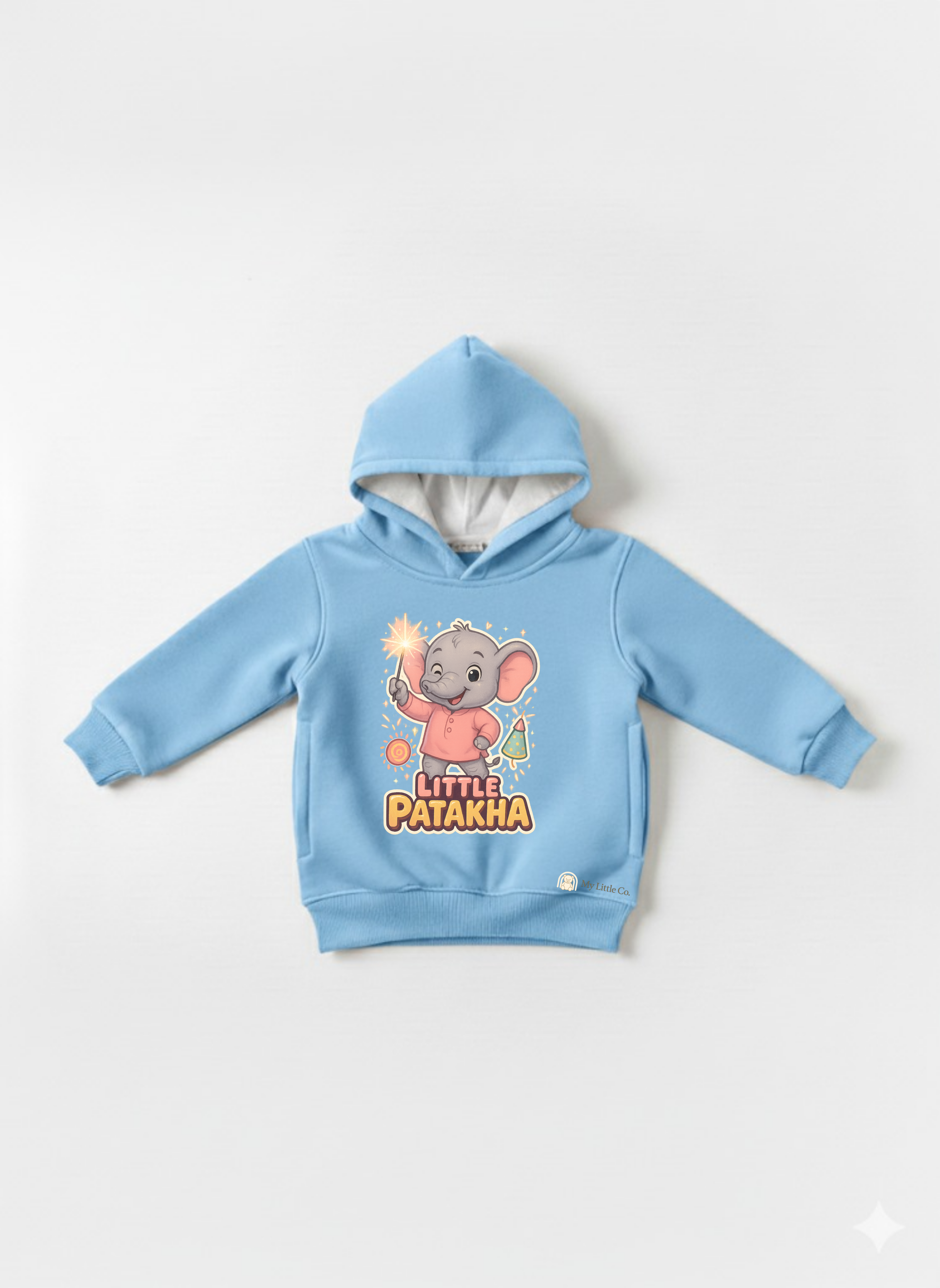 Close-up of witty "Little Patakha" slogan and sparkler elephant graphic on cheerful sky blue fabric.