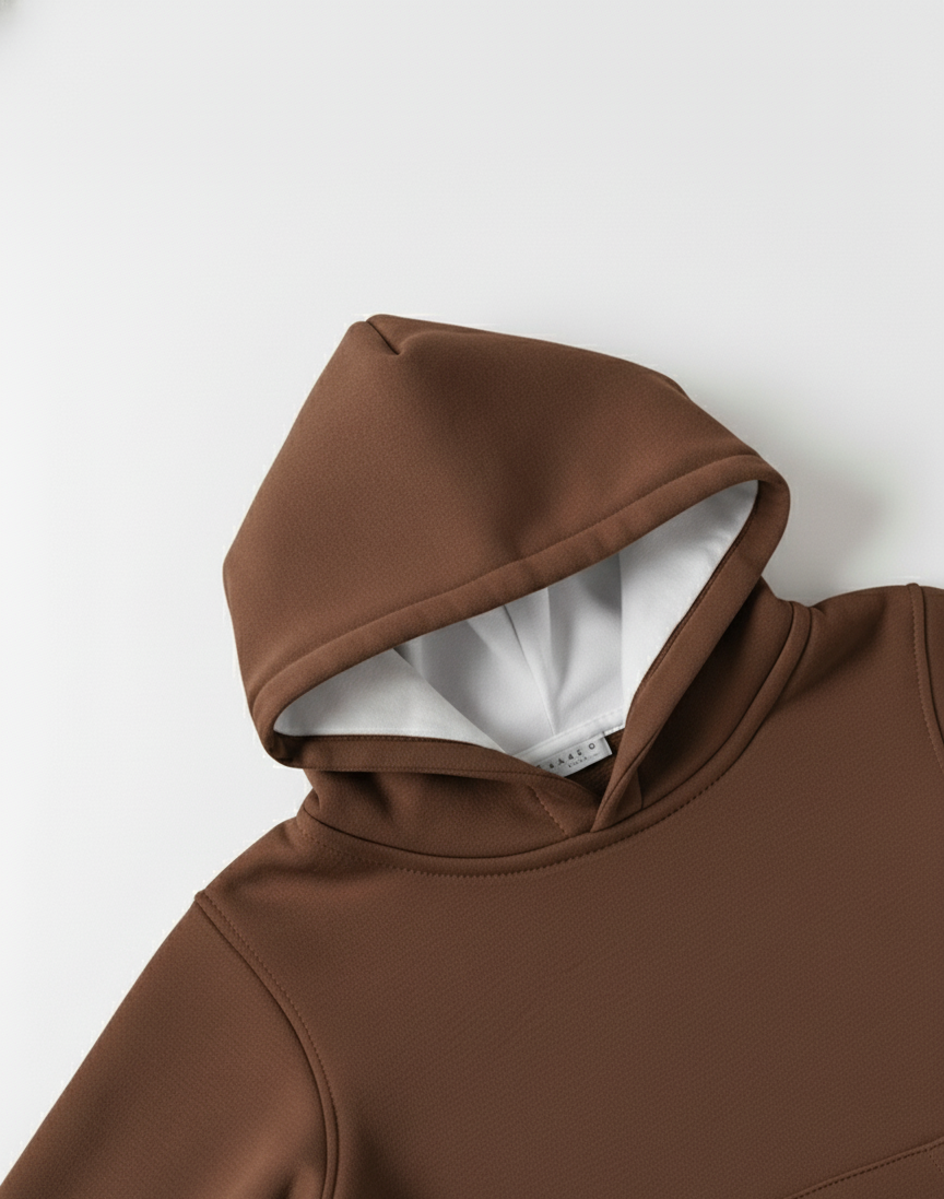 Brown hoodie with a white interior on a light gray background