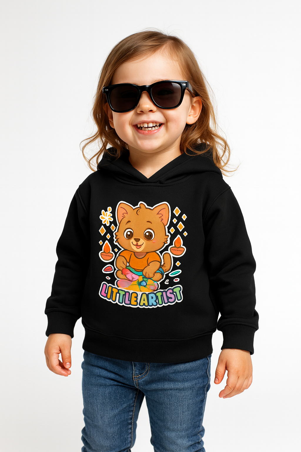 Imaginative toddler wearing Little Artist kitten hoodie (0−6 yrs) on black fabric.