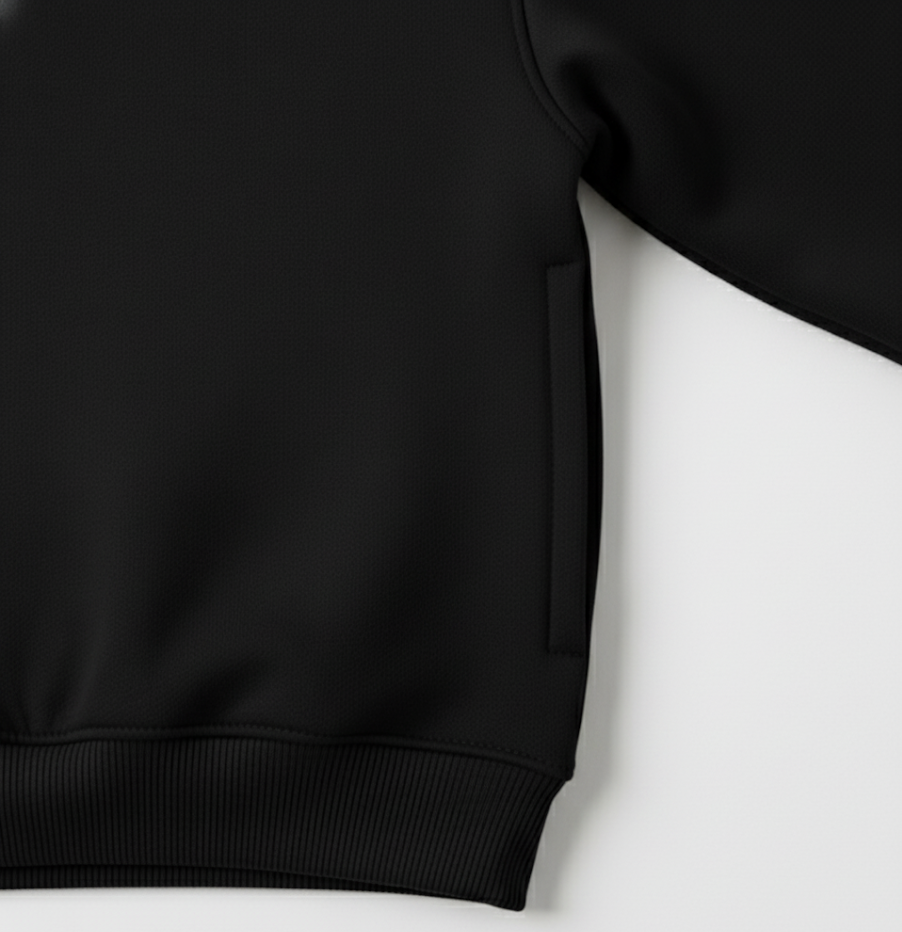 Close-up of soft bio-washed cotton fleece — smooth stretch fabric in black tone